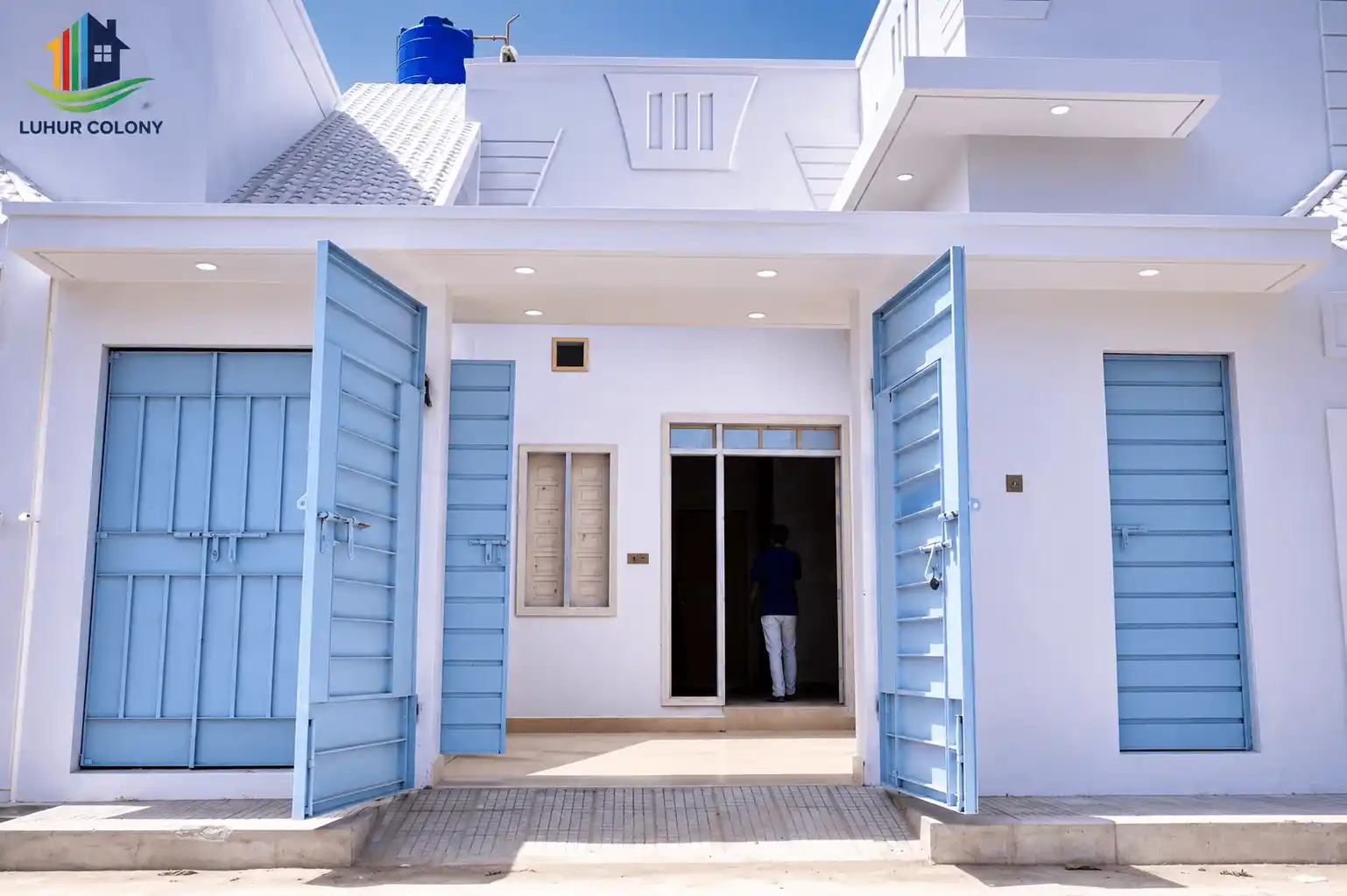 Luhur Colony villa exterior with landscaped entrance